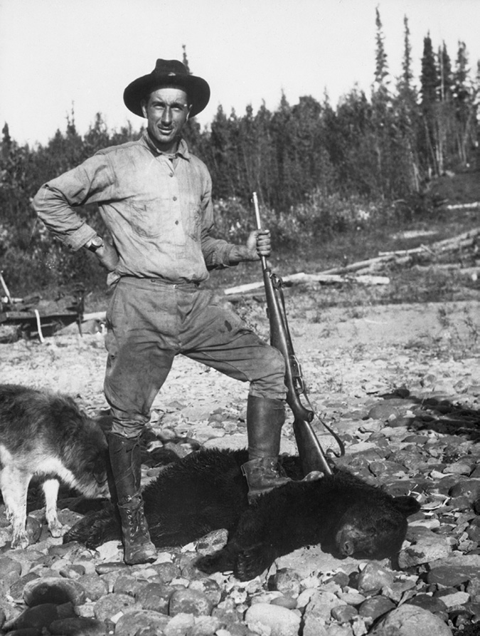 Link was a geologist who figured prominently in oil exploration in Alberta and the Northwest Territories (as well as South America) from the 1920s through the Leduc discovery. In this photo he strikes a Daniel Boone pose, standing over a dead bear, a rifle by his side and a husky dog behind him. He is wearing a field explorer’s outfit, Indiana Jones hat and boots.