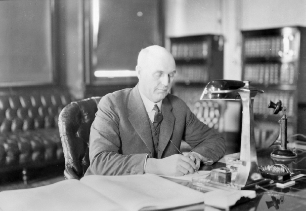 Charles Stewart, Minister of the Interior, writing notes on his desk