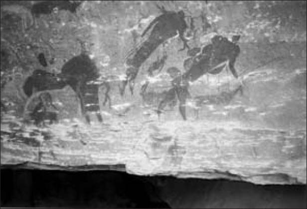A rock painting shows people on ox-wagons.