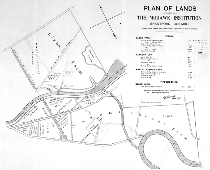 Black and white photograph of a lands map: Map is entitled “Plan of Lands, the Mohawk Institution, Brantford, Ontario.”  There is small, unreadable text below the title describing the Glebe Farm, the Babcock Lot, and the Manual Labour Farm.  The plan shows the large amount of land connected to and surrounding the school, as well as Glebe Farm, located across the canal from the school.