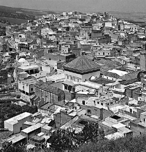 The tomb of Sdi Bu Qnadil, surrounded by smaller structures at the port, overlooks the Bay of Agadir.