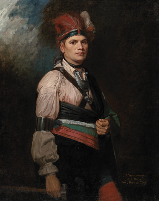 Colour painting. Full body portrait of a Haudenosaunee man against a dark background. He is wearing a red feather headdress, a white shirt, a black, white, green, and red sash, and a silver neckpiece. He is holding a cloth or the end of the sash over his left hand, which is held up to his mid-section, and is standing looking at the painter. He wears a wide silver armband just above his right elbow.