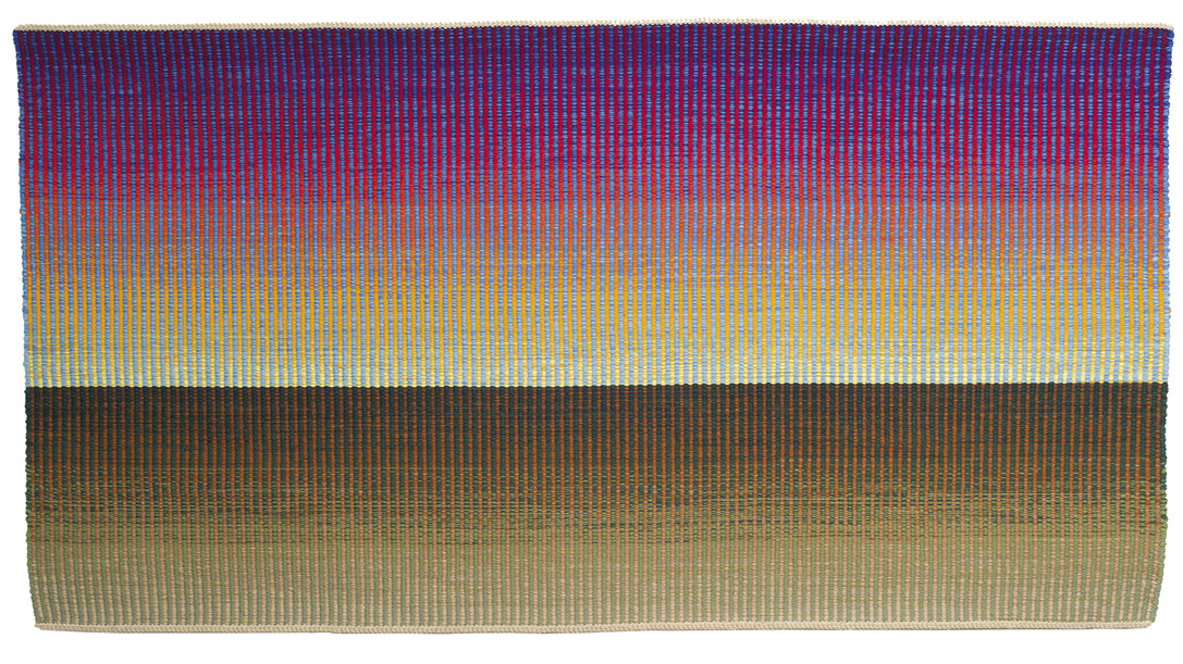 Photo: vertical lines make up this image in blue-pink fading to yellow. There is a horizon across the lower middle where the lines turn distinctly brown-green. 