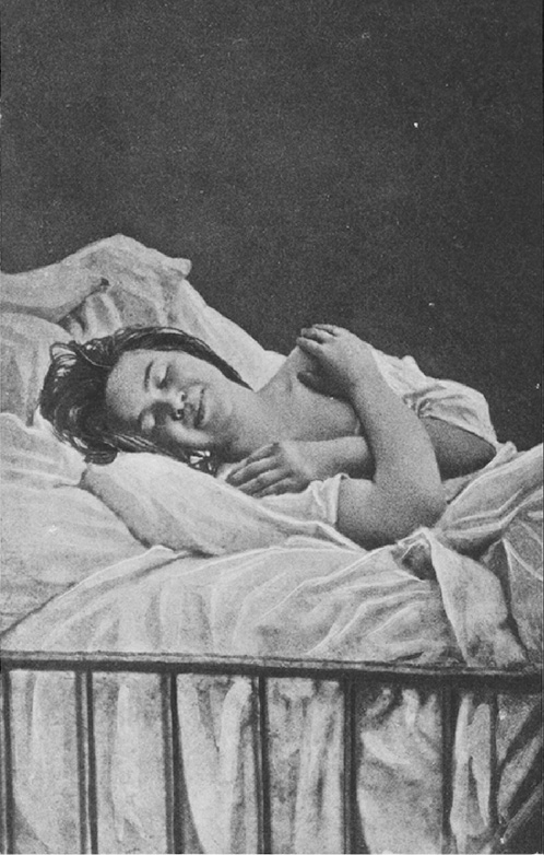 Black and white photograph. A woman is laying in a bed with her eyes closed, and arms folded over her chest. She is wearing a white night gown. The blankets and pillows are crumpled, and the bars of the bed are visible at the bottom of the photograph.