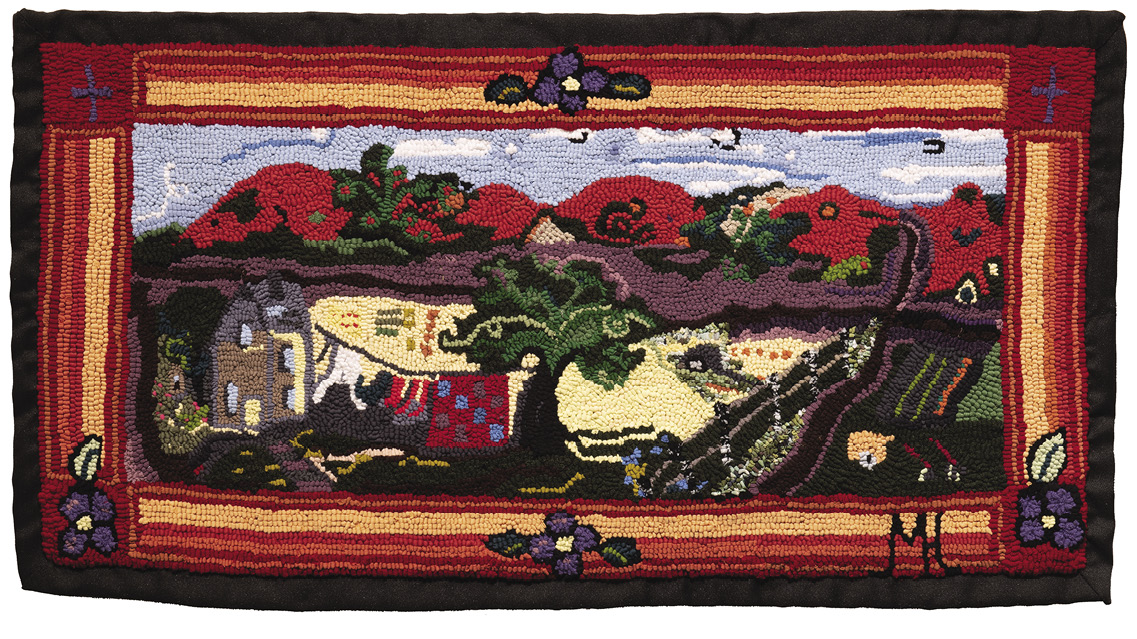Farm scene on a rug outlined in stripes of red, orange, and yellow with purple flowers and crosses and thick black. The scene has a house in the left corner, fields with rows of crops, and red hills in the background beneath blue skies.
