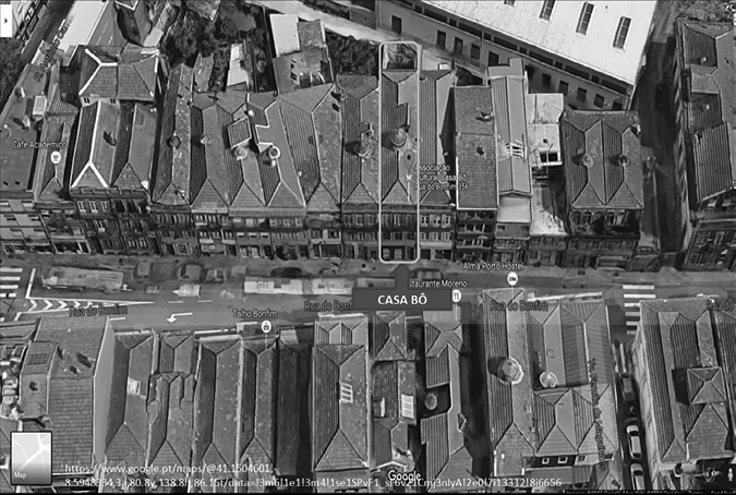 Black and white photograph, satellite photograph of tall, narrow terraced buildings facing towards a street, the Casa Bô is circled on the upper side of the street.