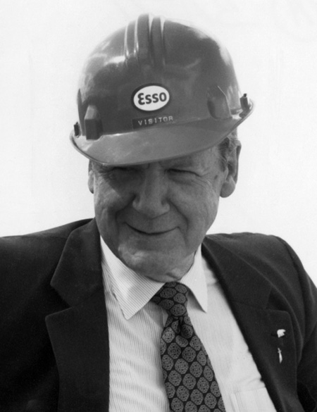 J.A. (Jack) Armstrong was president and chief executive of Imperial Oil during the tumultuous years of price instability and confrontations with the governments of Alberta and Canada in the 1980s. He is shown wearing a hard hat with the Esso logo, reflecting his orientation toward exploration and development of new sources of oil.