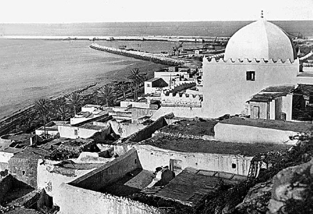 The tomb of Sdi Bu Qnadil, surrounded by smaller structures at the port, overlooks the Bay of Agadir.