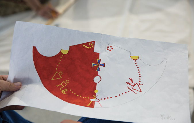 Colour Photograph: Red, White, Yellow, and Blue sketch of ii’ taa’poh’to’p Tipi Design Painting. 