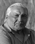 Black and white photograph: Portrait of a man wearing a collared shirt.