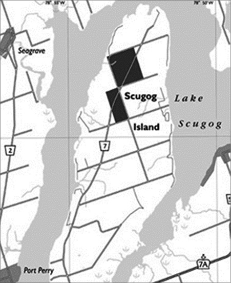 Black and white map. Map of Lake Scugog and Scugog Island. Roads cross the land going north to south and east to west. In the northern part of Scugog Island there are two black rectangles showing the properties that constituted the Mississaugas of Scugog Island Reserve in 1844.