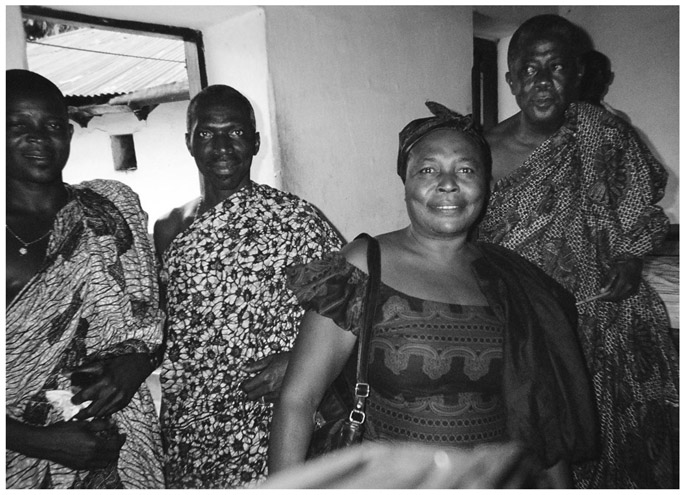 A black and white photograph of Manya Krobo Chiefs and Queenmother gathered in a room.