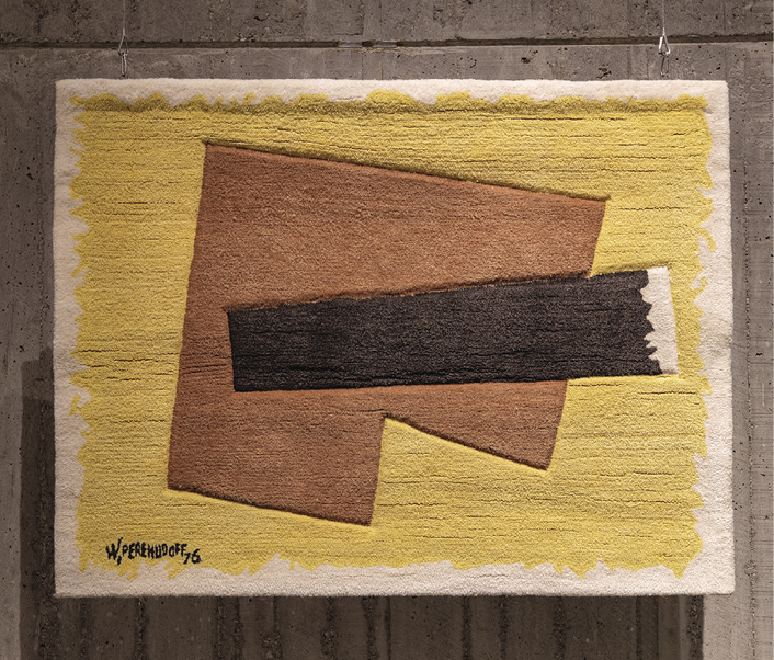 Photo: yellow rectangle hanging with a white border against a grey cement wall. A tilted brown square with a chunk out of the bottom right sits in the middle of the piece with a dark brown long shape across the middle right. It is signed in black in the left-bottom corner