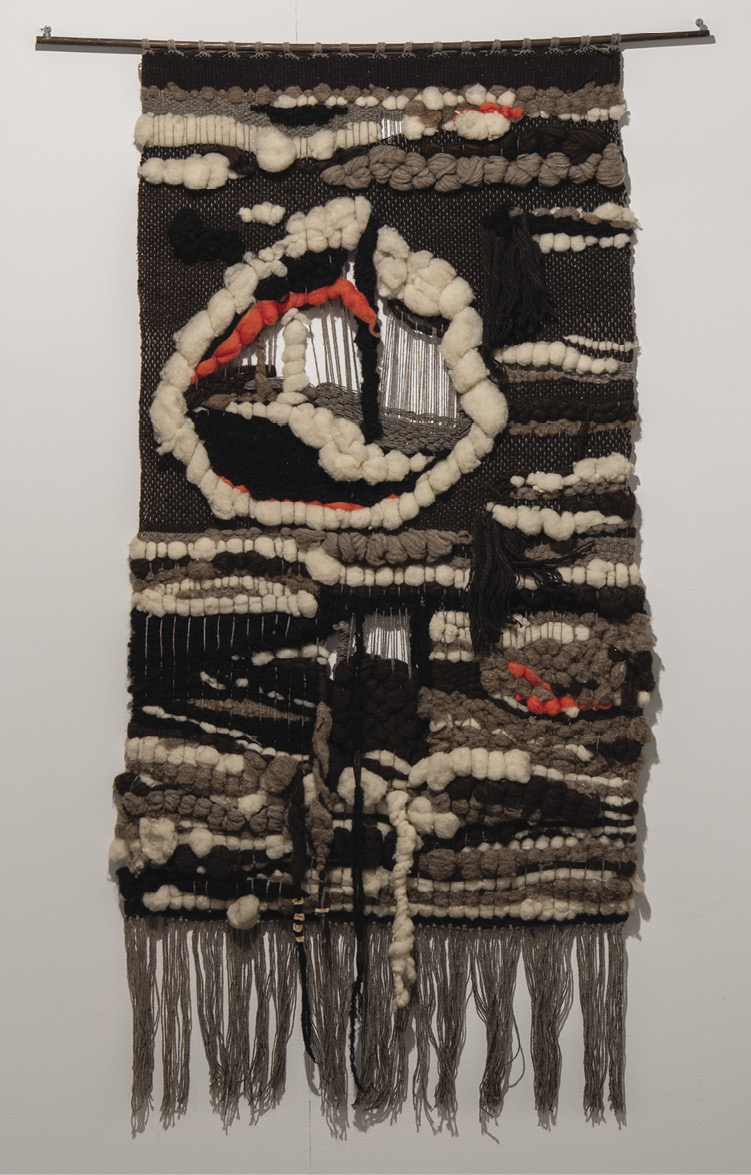 Dark brown and tan hanging with a fringe bottom and bursts of orange. It is mostly horizontal lines with a notable large circle in the upper left. 
