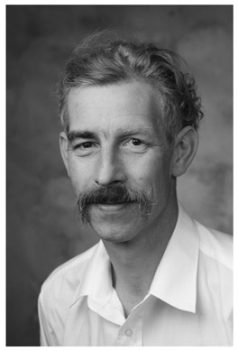 A black and white portrait of Professor Tim Quinlan.