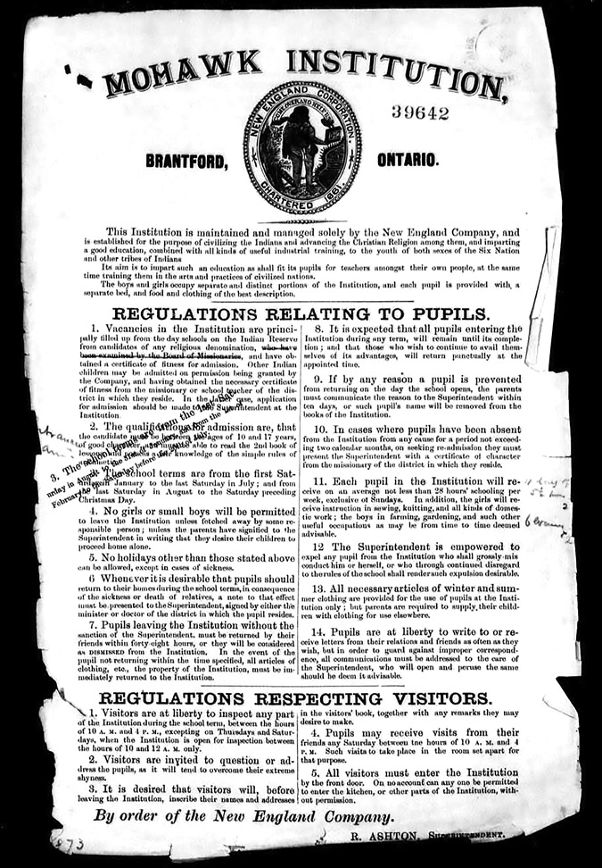 Black and white photograph of a printed document: Archival document from 1872 listing the rules for visitors and pupils at the Mohawk Institute. The seal of the New England Company is at the top of the document.  The rules for pupils include the following: vacancies are filled primarily from students enrolled in the day schools; students are supposed to be 10 to 17 years and have basic skills to be admitted; children can’t leave the school without permission; if a student goes home for an ill relative, a doctor’s note must be provided; if students leave and do not return within 48 hours they will be dismissed; students must return from leaves at the appointed time; students who leave and want to be readmitted need a certificate of character from a missionary; children are to receive at least 28 hours of schooling per week, along with trade and domestic training; the superintendent can expel any student; clothing is provided for use at the school but parents must provide other clothing; and finally, students are permitted to write and receive letters but they are to be vetted by school officials. There are also five rules for visitors: visitors are able to inspect the school but only at set times; visitors can address the students; visitors will sign a guestbook and provide remarks; friends of students can visit on Saturday in the room set aside for that purpose; and finally, all visitors have to enter via the front door. 