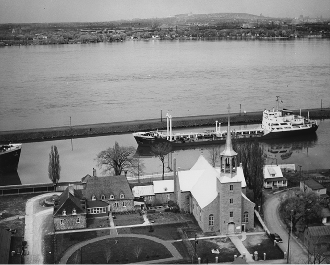 This photograph shows a lock in the St. Lawrence Seaway across from Montreal in the 1950s.